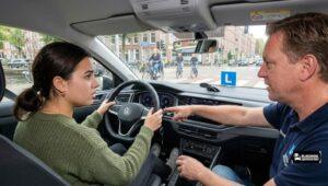 First driving lesson in Amsterdam West: instructor explains training car controls