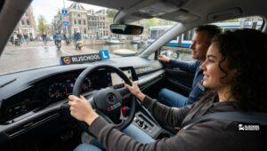 Student taking driving lesson for rijbewijs B in Amsterdam West with instructor