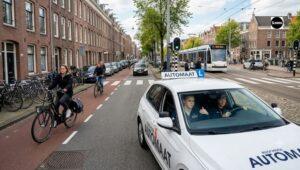 Automatic training car during driving lesson in Amsterdam West with a focus on city traffic